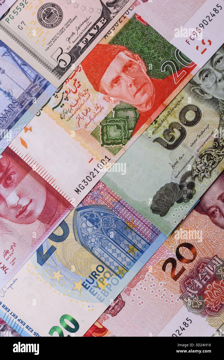 Paper money, banknotes of different countries as a business background. Paper money and cash Stock Photo