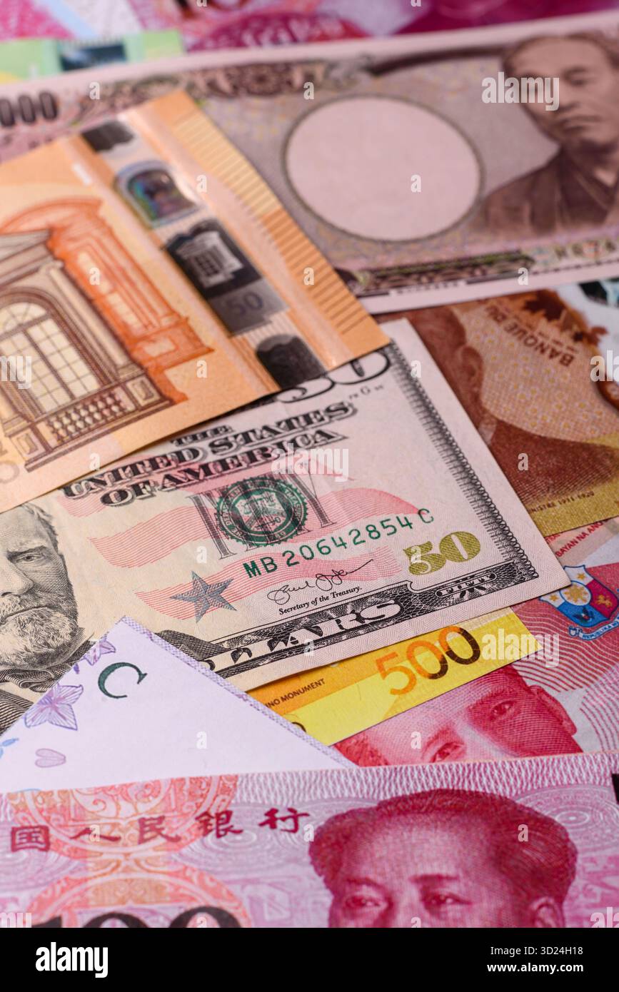 Paper money, banknotes of different countries as a business background. Paper money and cash Stock Photo