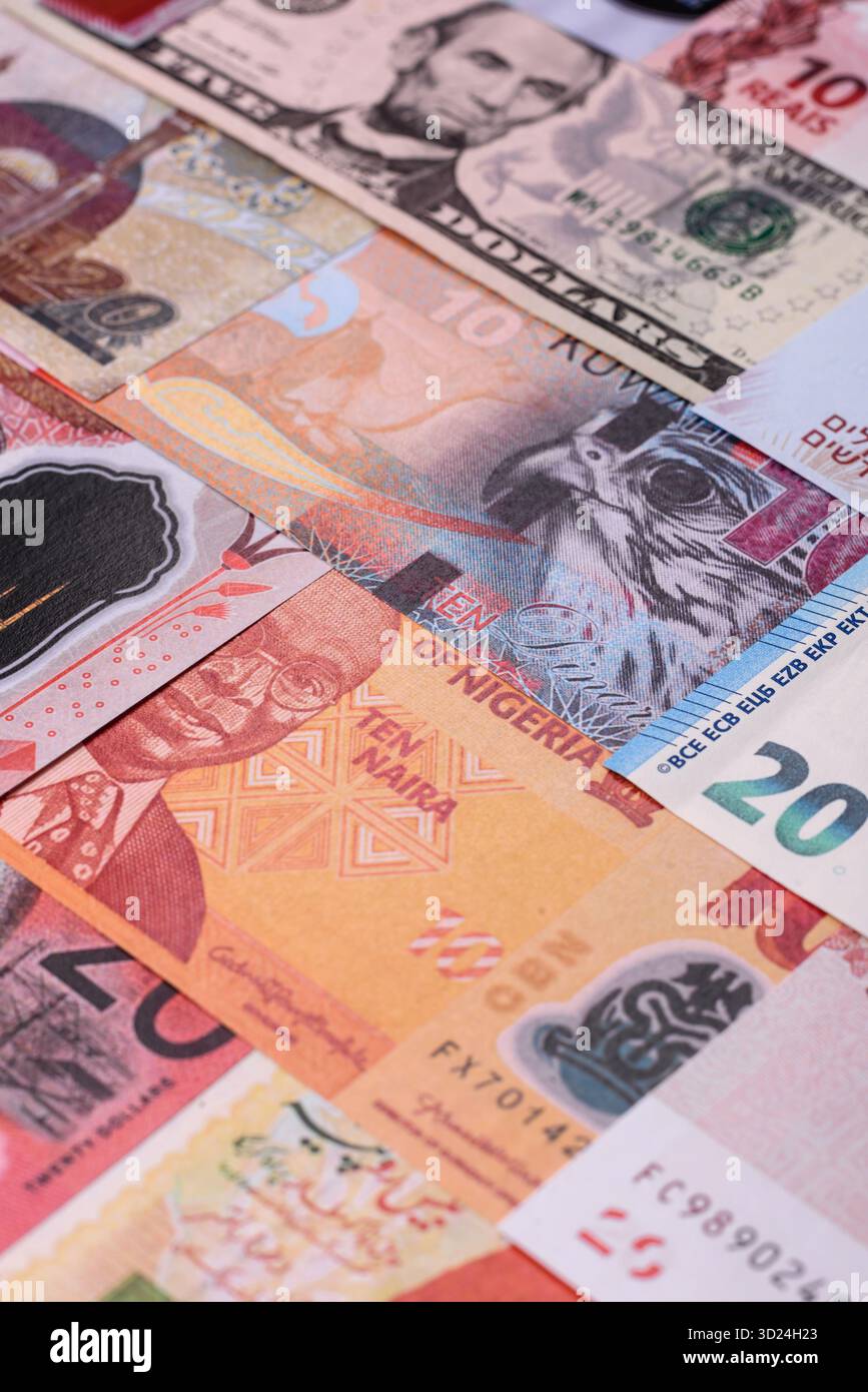 Paper money, banknotes of different countries as a business background. Paper money and cash Stock Photo