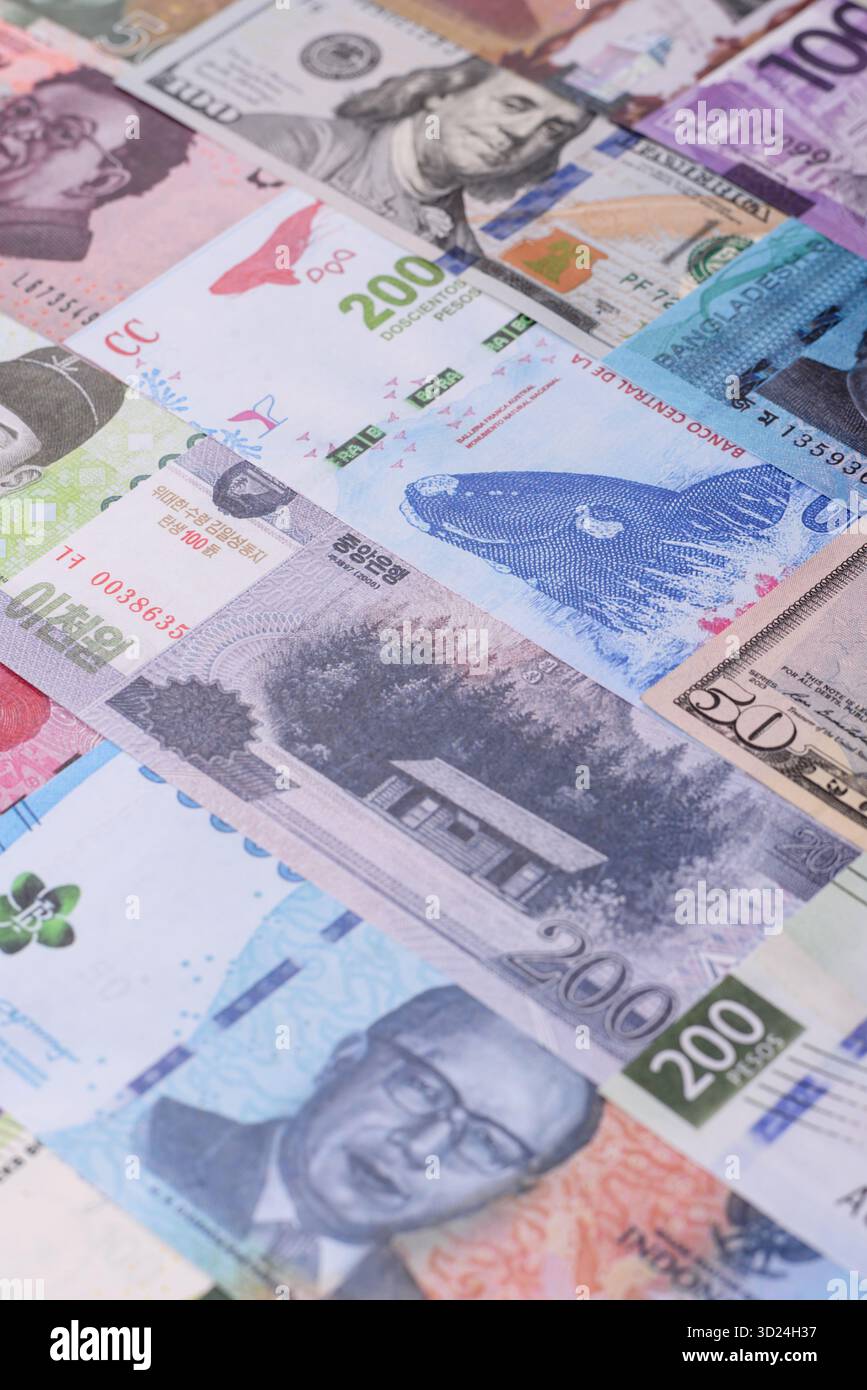 Paper money, banknotes of different countries as a business background. Paper money and cash Stock Photo