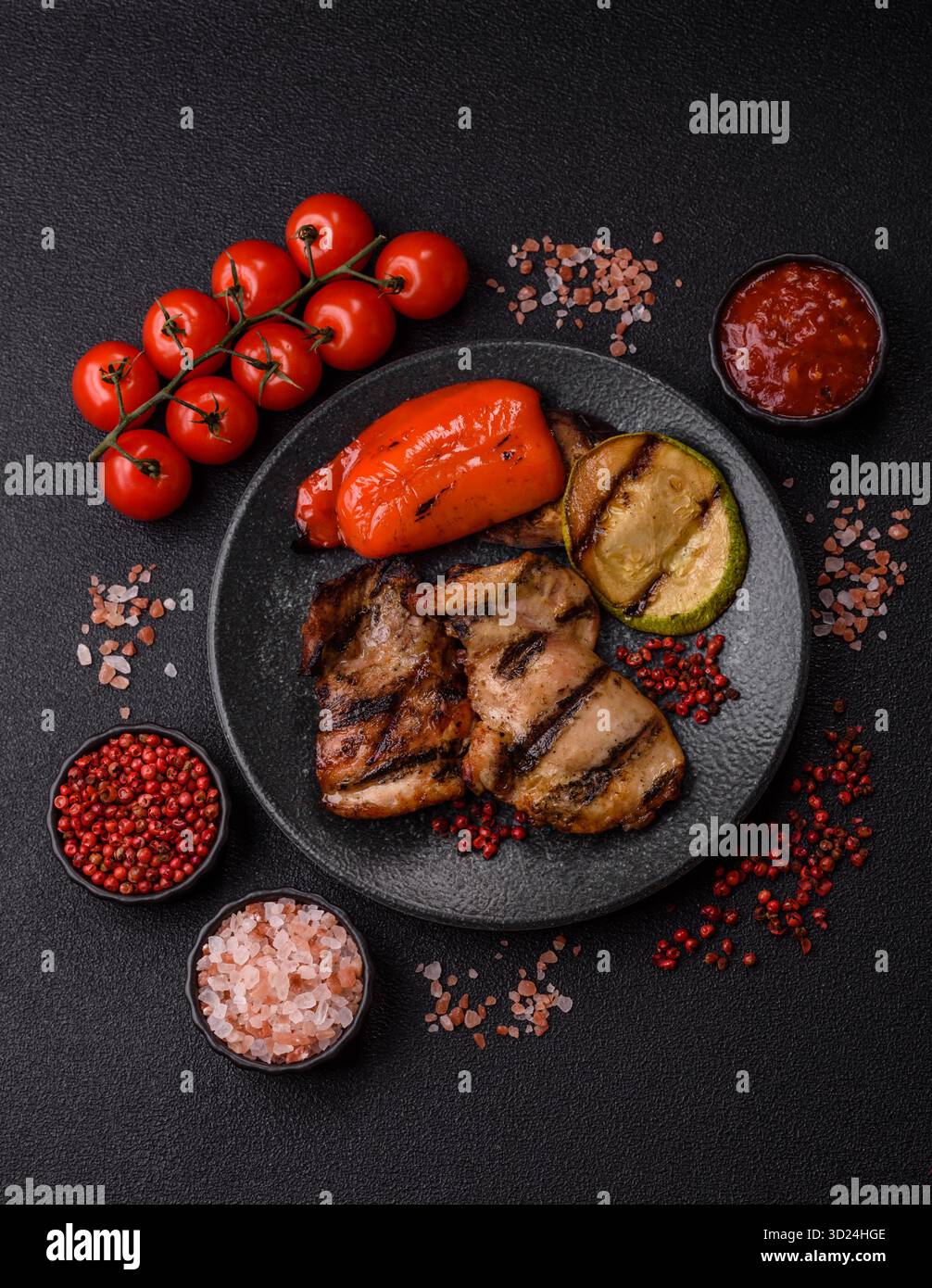 Chicken breast cooked on a grill or barbecue with sauce. Grilled chicken Stock Photo