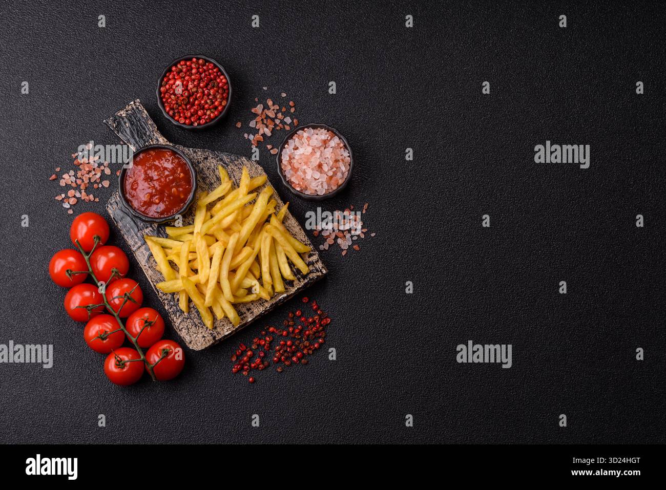 French fries cooked in oil, crispy golden chips, unhealthy food. French fries as a background Stock Photo