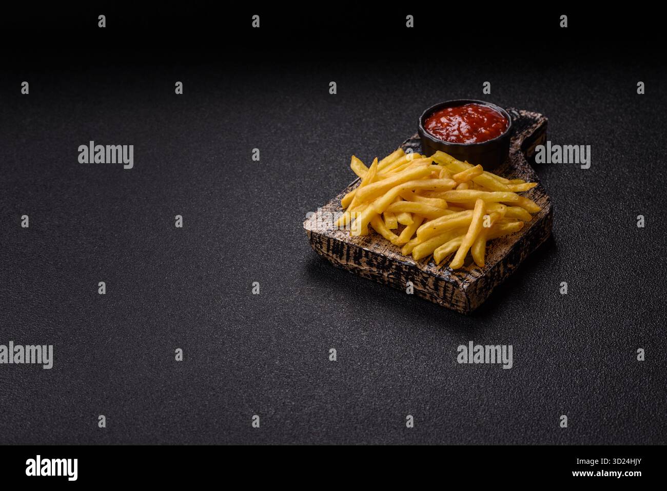 French fries cooked in oil, crispy golden chips, unhealthy food. French fries as a background Stock Photo
