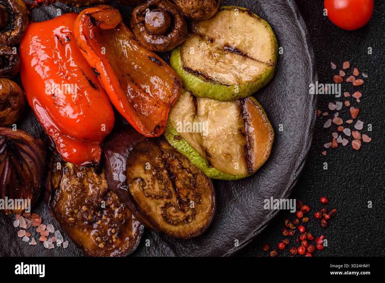 Grilled vegetables, bell peppers, mushrooms, and zucchini, a vegetarian meal. Grilled vegetables Stock Photo
