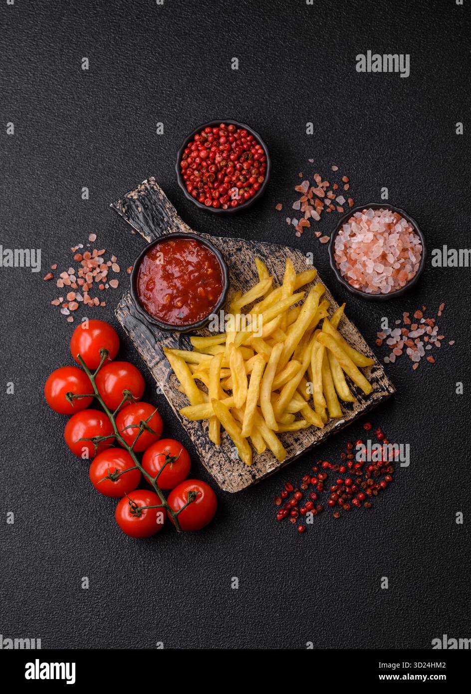 French fries cooked in oil, crispy golden chips, unhealthy food. French fries as a background Stock Photo