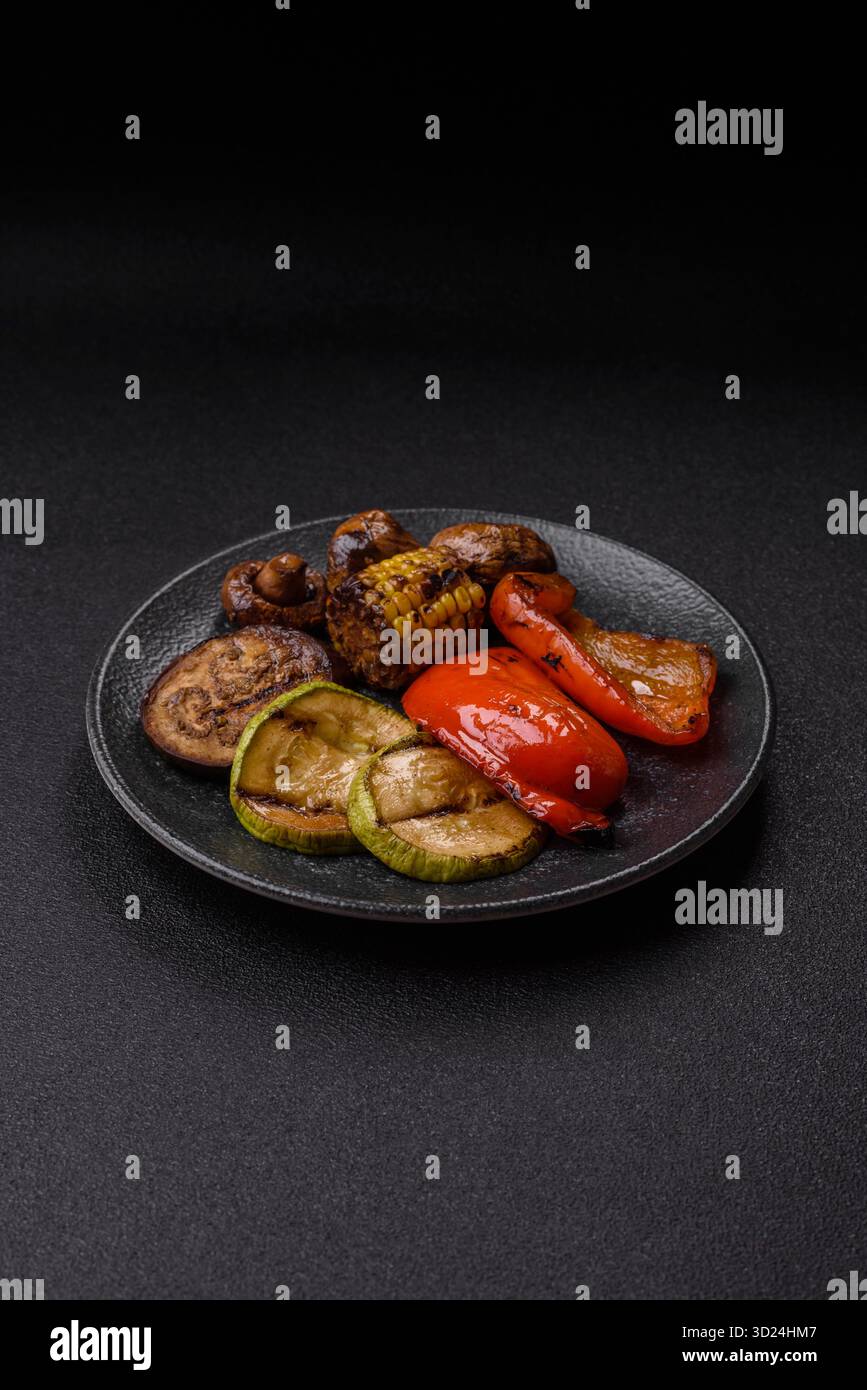 Grilled vegetables, bell peppers, mushrooms, and zucchini, a vegetarian meal. Grilled vegetables Stock Photo
