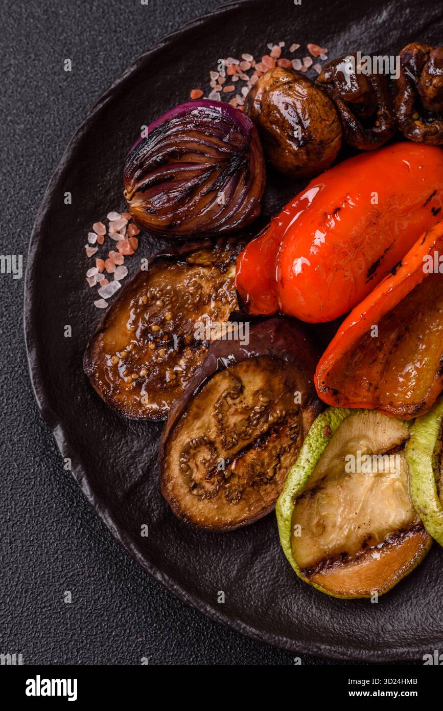 Grilled vegetables, bell peppers, mushrooms, and zucchini, a vegetarian meal. Grilled vegetables Stock Photo