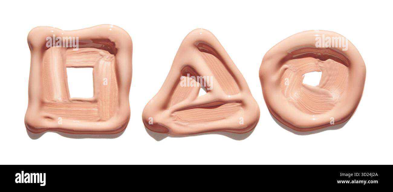 Geometric shapes in nude makeup foundation texture on white background Stock Photo