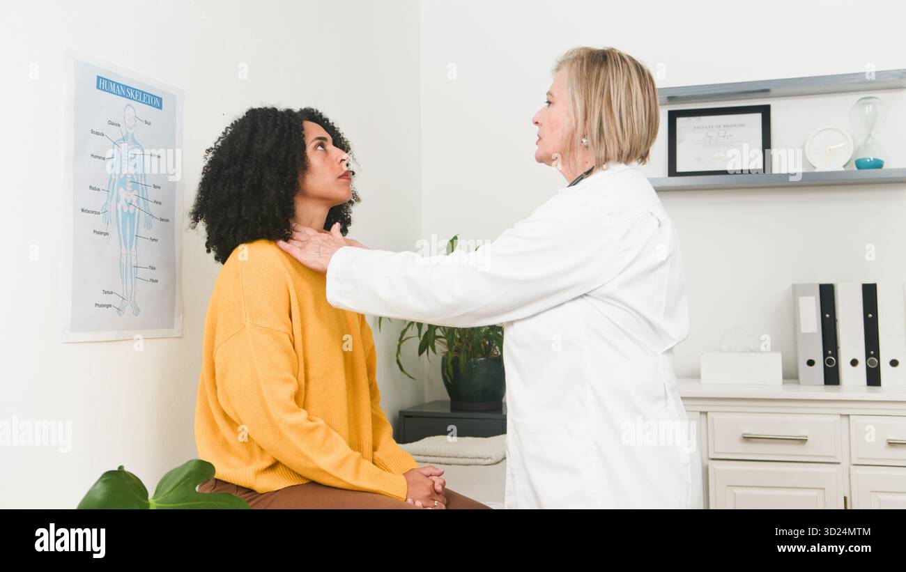 Doctor Examining Patient in Medical Office With Skeleton Chart and ...