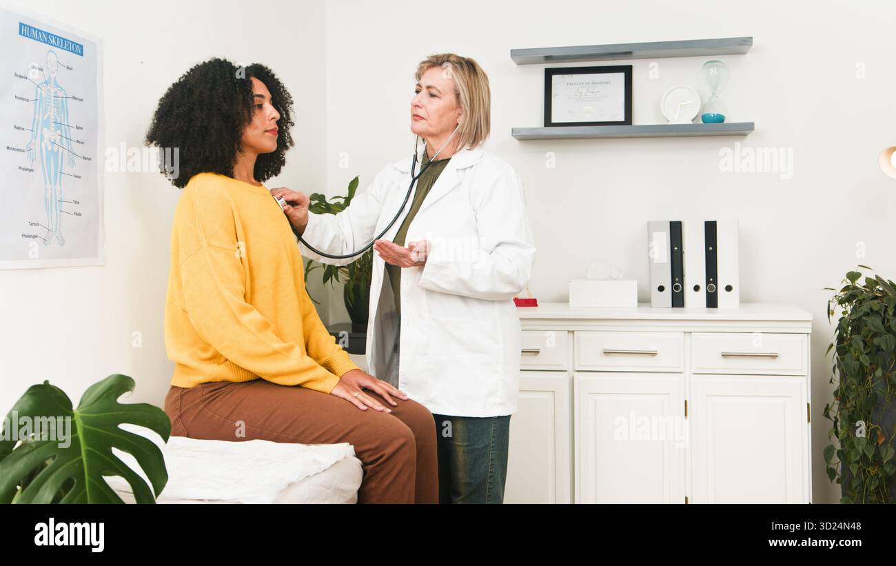 Caring doctor checks patient hi-res stock photography and images - Alamy