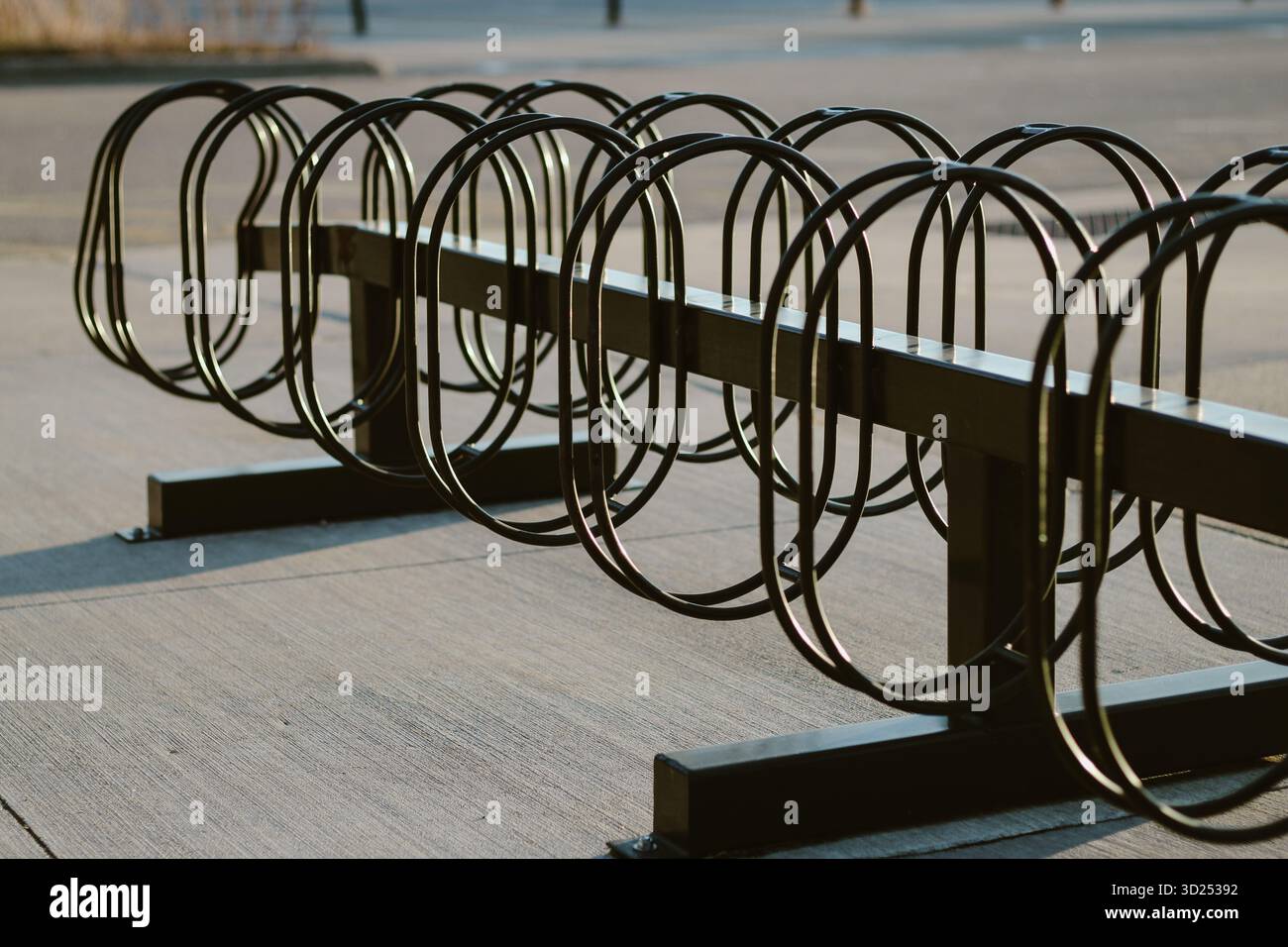 Metal geometric round bike parking racks in diminishing perspective ...