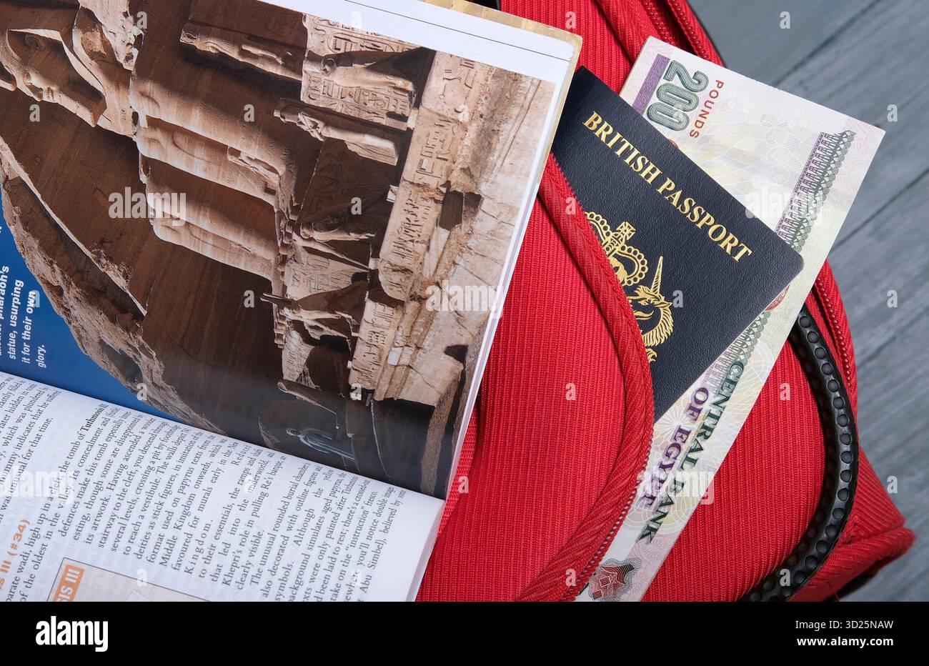 Egypt travel guide book with british passport and Egyptian currency Stock Photo