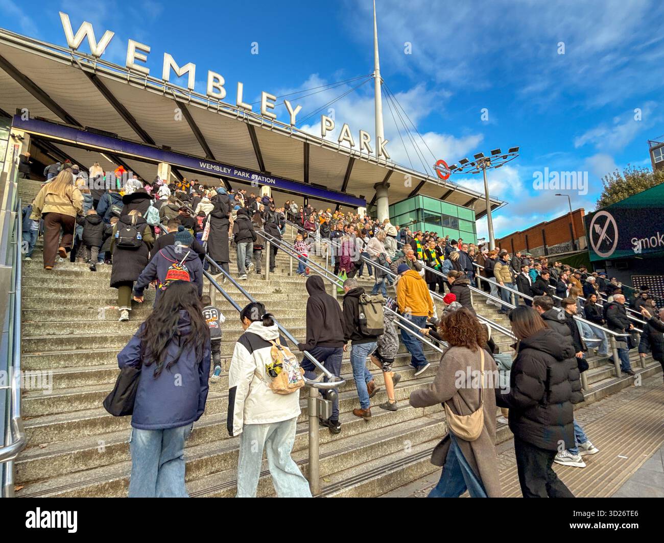 London, England, Uk - 25 October 2025: Sports fans going in and out of Wembley Park Underground railway station for a major sporting event at Wembley - Smartphone Captured Stock Image