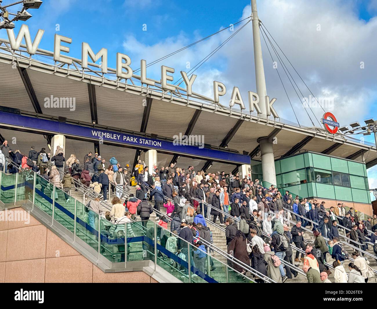 London, England, Uk - 25 October 2025: Sports fans leaving Wembley Park Underground railway station for a major sporting event at Wembley stadium. - Smartphone Captured Stock Image