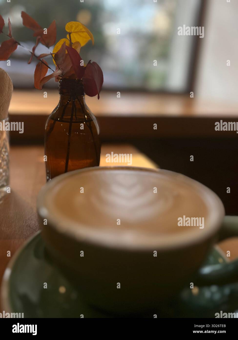 A cup of hot coffee in an autumn coffee shop - Smartphone Captured Stock Image