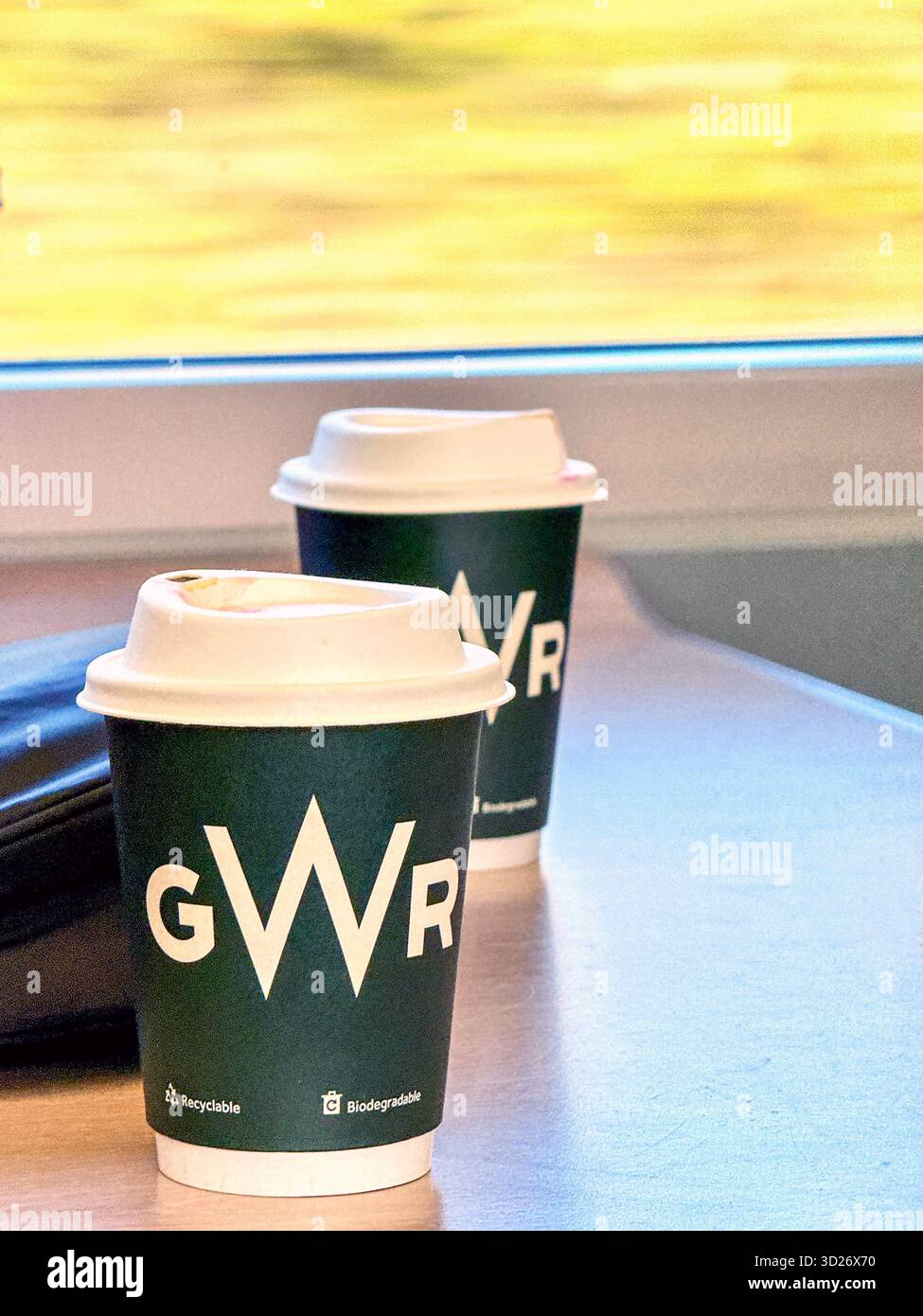 Cardiff, Wales, UK - 24 October 2025: Coffee in disposable cups with plastic lids on a high speed train operated by Great Western Railway. - Smartphone Captured Stock Image