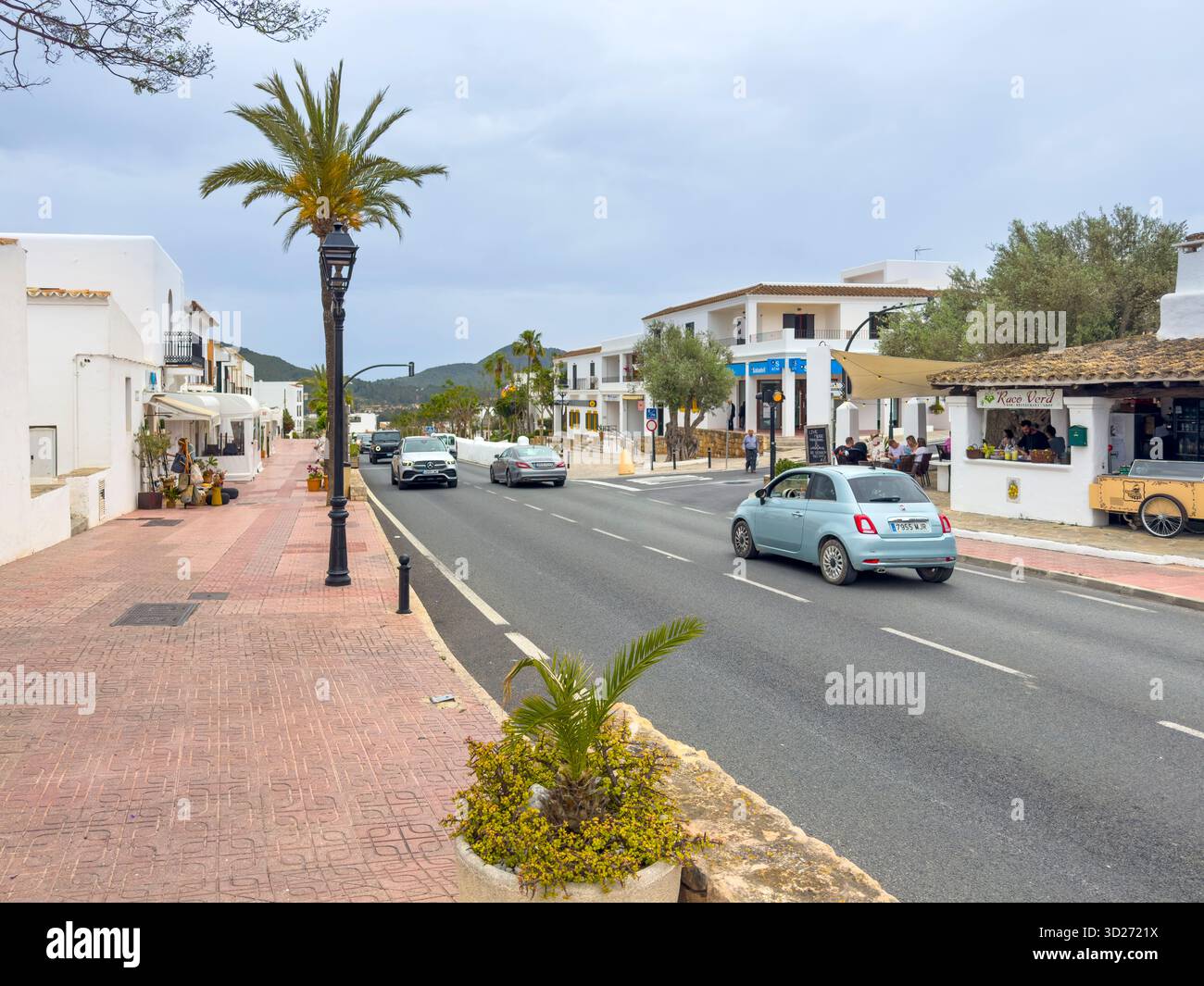 Carrer de Pere Escanellas lined with shops, restaurants and bars in the centre of Sant Josep de sa Talaia, Ibiza, Spain: Phillip Roberts - Smartphone Captured Stock Image