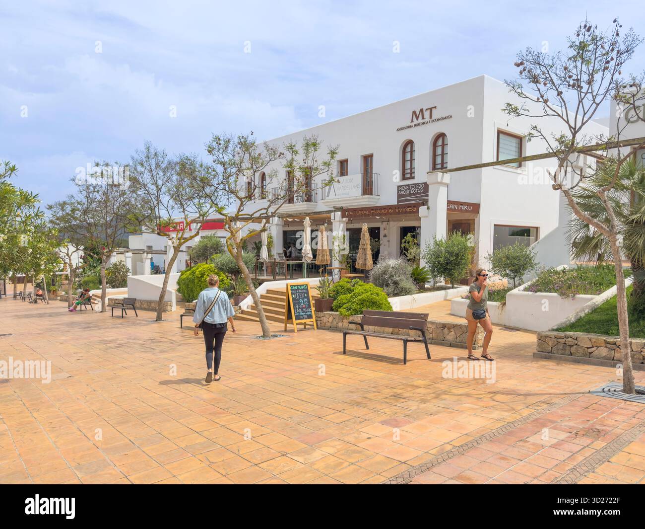Carrer de Pere Escanellas lined with shops, restaurants and bars in the centre of Sant Josep de sa Talaia, Ibiza, Spain: Phillip Roberts - Smartphone Captured Stock Image