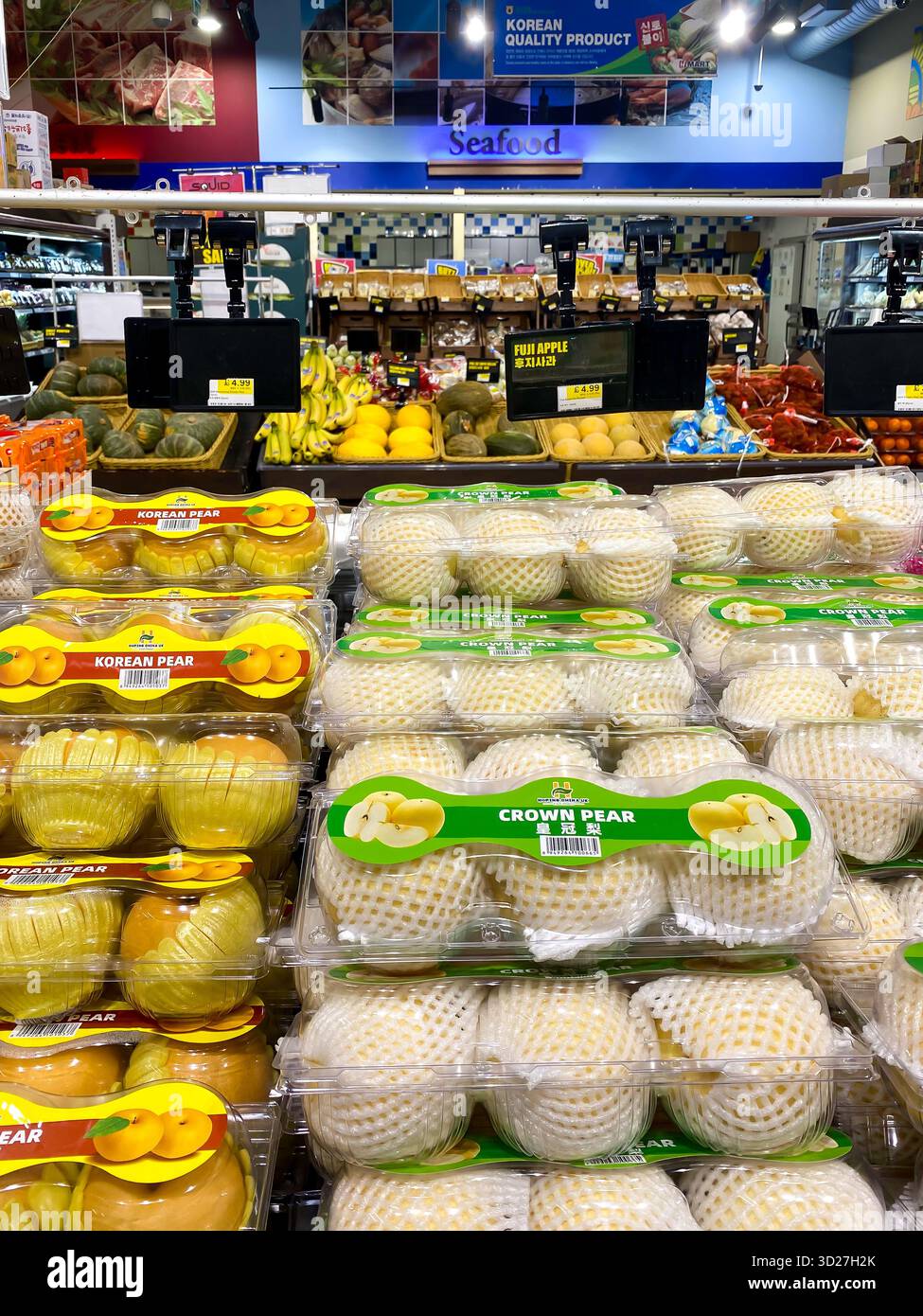 Asian pears on sale in an Asian supermarket in London, UK - Smartphone Captured Stock Image