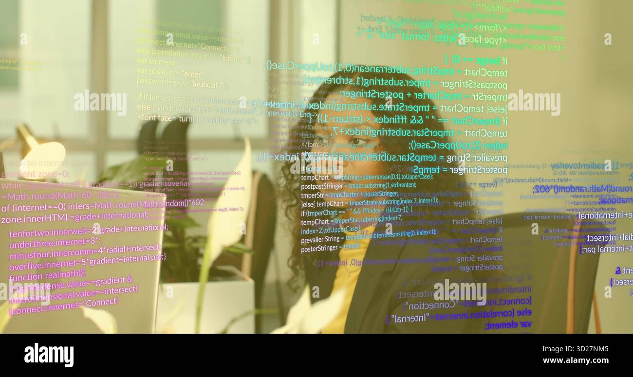 Typing coder writing code on monitor at office desk, with plant, lamp and code overlay Stock Photo