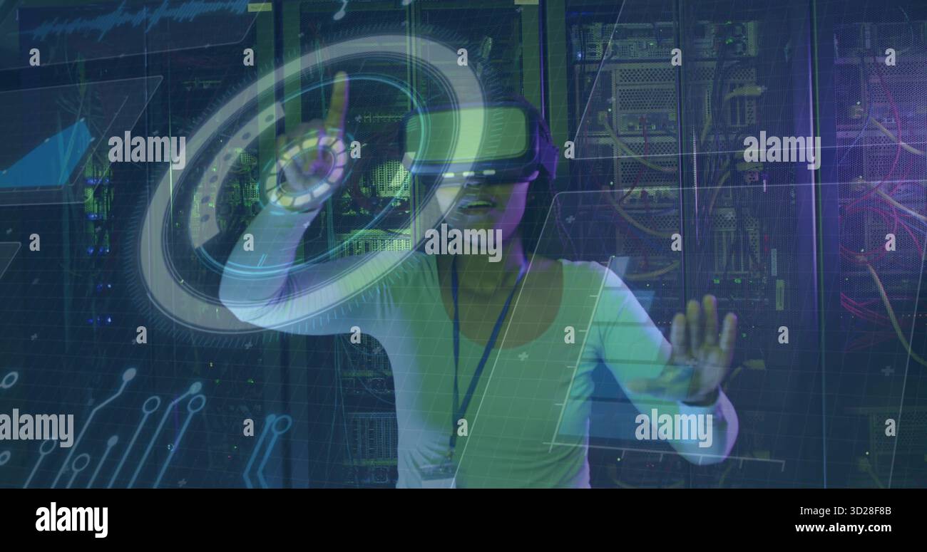 Manipulating holographic interface wearing VR headset at data center, with server racks and cables Stock Photo