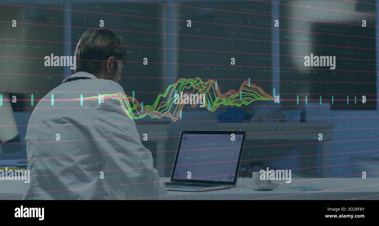 Analyst wearing business attire analyzing data on laptop in office with ...