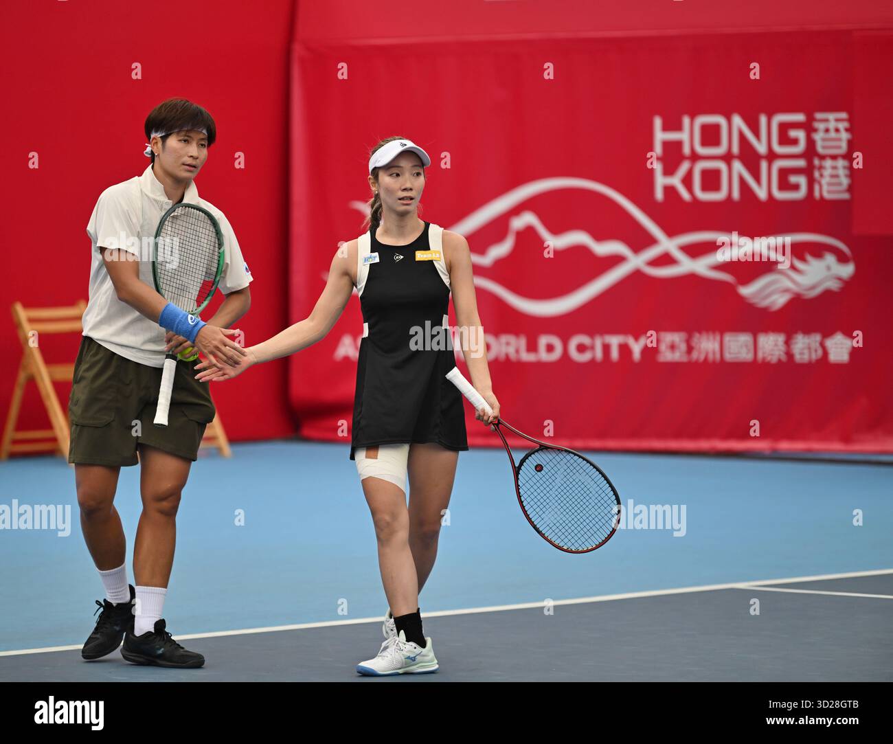 Thailand tennis player Peangtarn Plipuech and Japanese tennis player Momoko Kobori during a match at the Hong Kong Tennis Open on October 31, 2025 in Hong Kong. (Photo by Kobe Li/Nexpher Images) Stock Photo