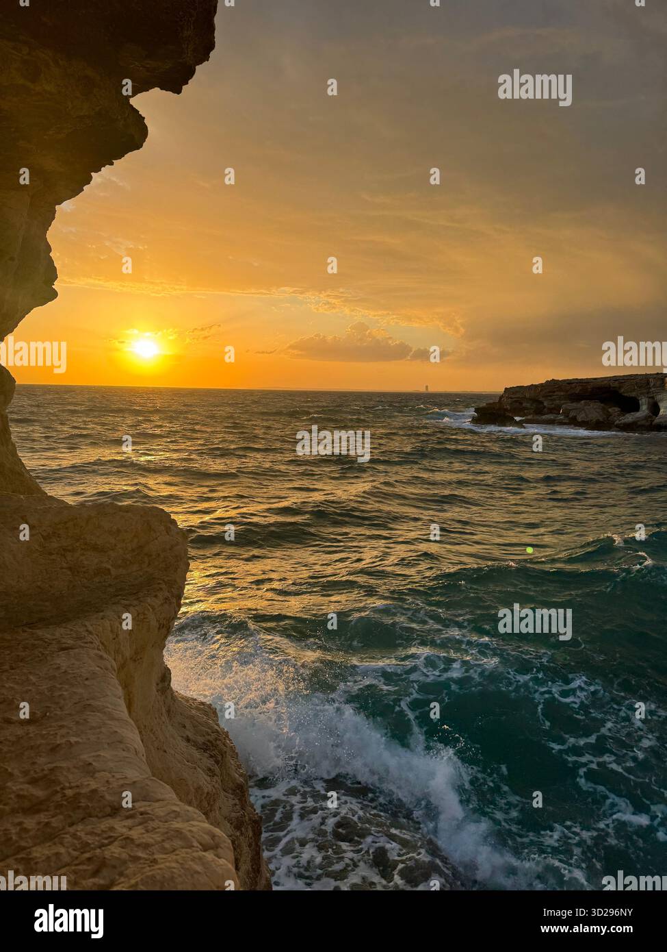 That moment when the clouds steal the show and the sea reminds you just how powerful nature is. The final, spectacular curtain call before the night - Smartphone Captured Stock Image