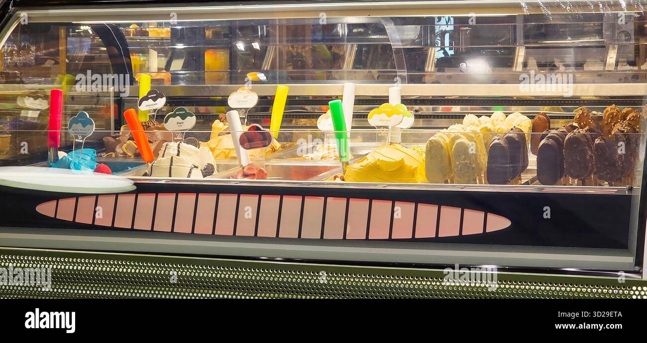 Doloman, Turkey - April 25, 2025: Colorful ice cream display showcases a variety of flavors and treats in a modern shop. - Smartphone Captured Stock Image