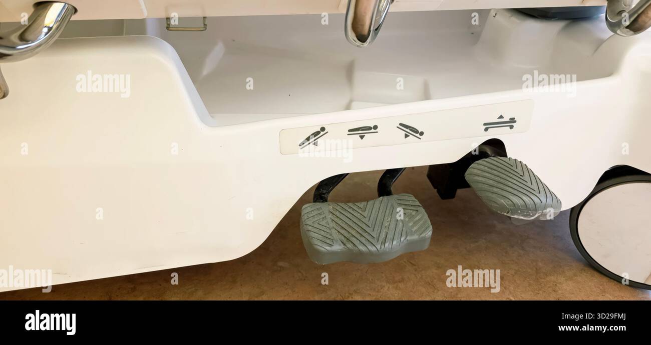 Berlin, Germany - June 16, 2025: Medical device foot pedals feature instructional symbols for user guidance and operation. - Smartphone Captured Stock Image