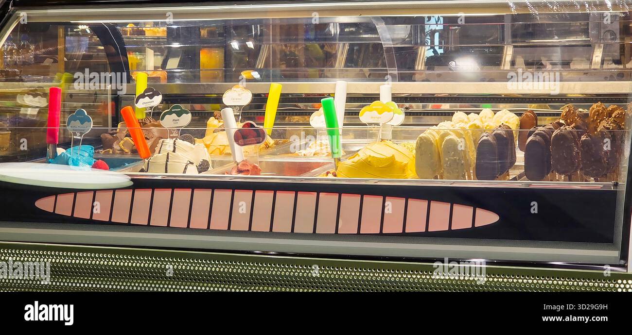 Doloman, Turkey - April 25, 2025: Colorful ice cream display showcases a variety of flavors and treats in a modern shop. - Smartphone Captured Stock Image