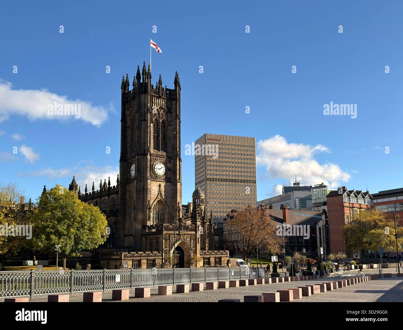 Manchester Cathedral and tower block of the Arndale shopping centre from Cathedral Approach in Manchester City centre - Smartphone Captured Stock Image