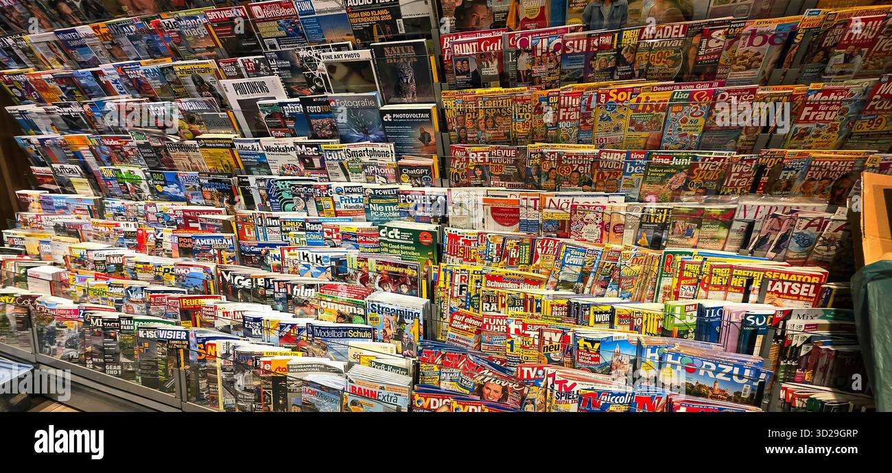 Berlin, Germany - June 13, 2025: Colorful array of magazines displayed in a newsstand showcasing various genres and topics. - Smartphone Captured Stock Image