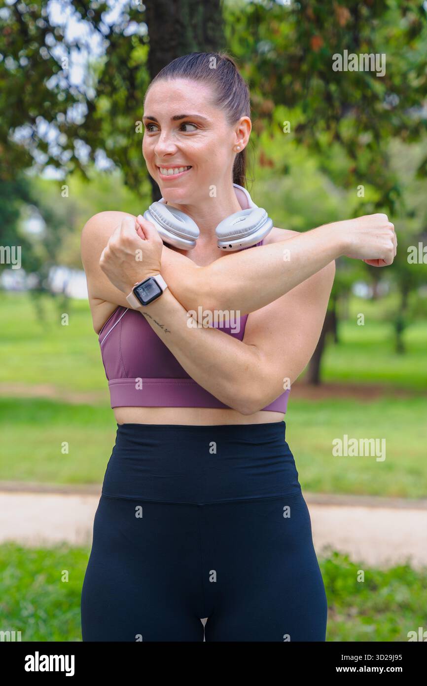 Woman stretching arm across hi-res stock photography and images - Alamy