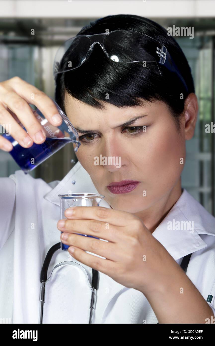 Research scientist testing specimen in laboratory Stock Photo