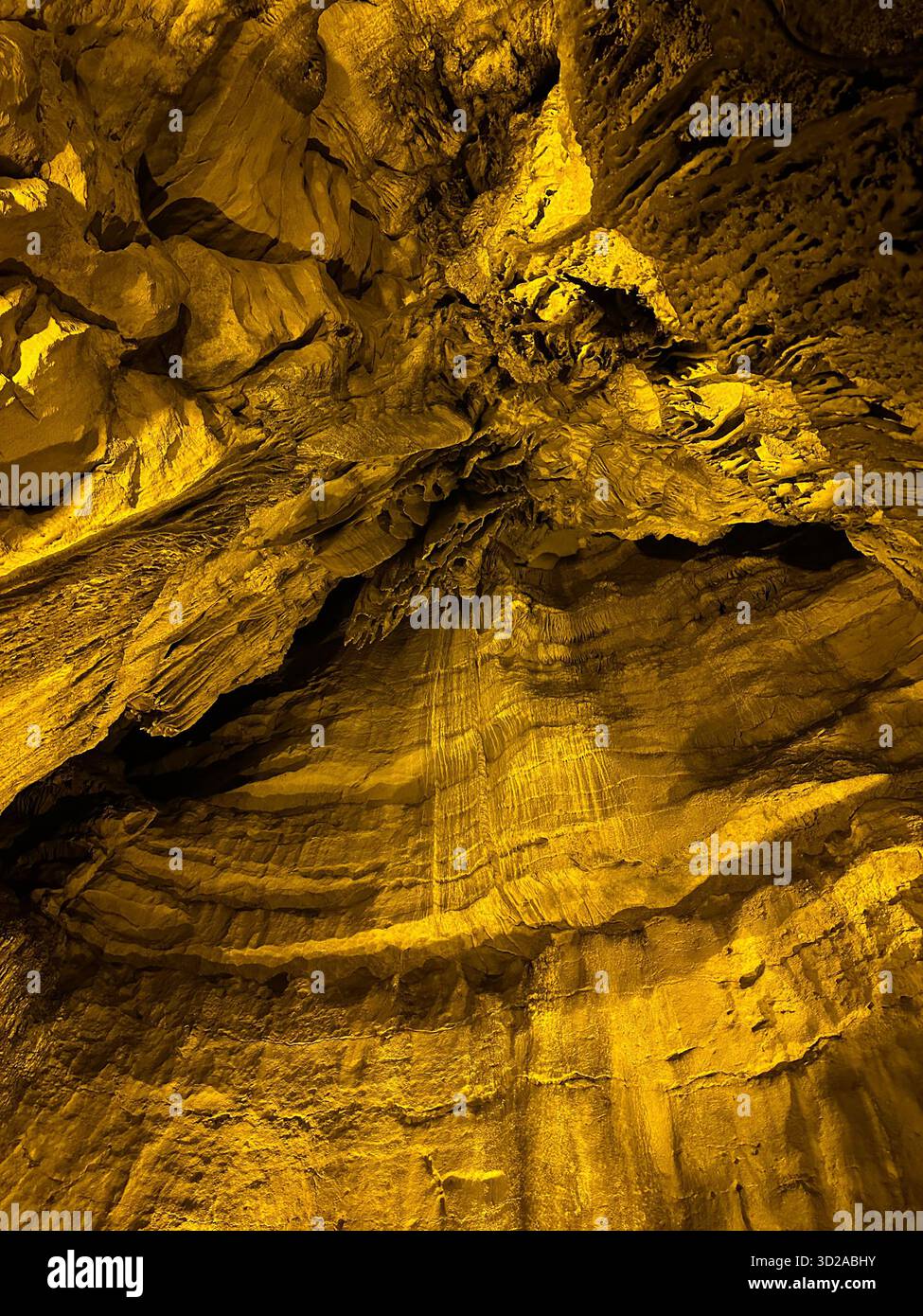 Golden lit limestone cave - Smartphone Captured Stock Image