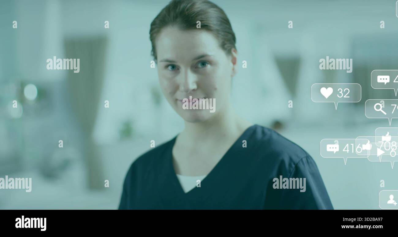 Standing nurse in scrubs looking at camera in clinic, with medical ...