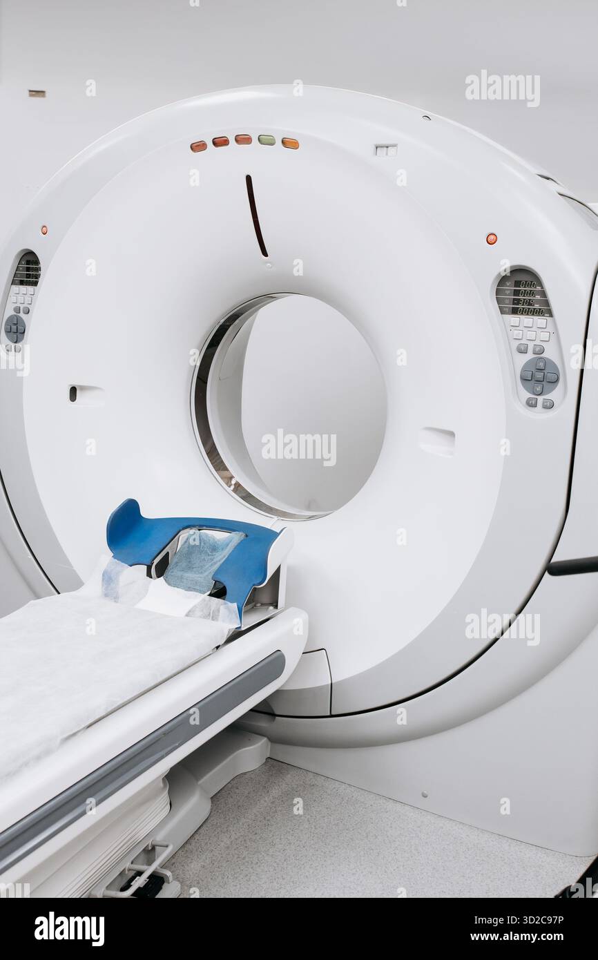 Advanced CT scanner machine showcases a patient bed and control panel ...