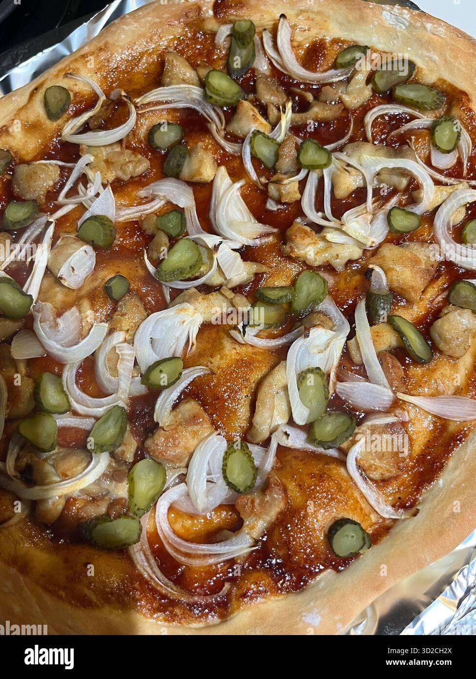 Homemade Pizza with Chicken, Onions, Pickles, and BBQ Sauce - Smartphone Captured Stock Image
