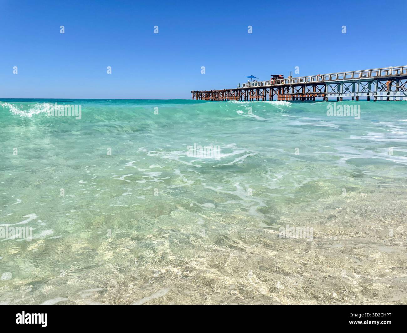 The turquoise blue waters of Egypt's North Coast, at a resort beach near Ras Al Hikma in Matrouh Governorate - Smartphone Captured Stock Image