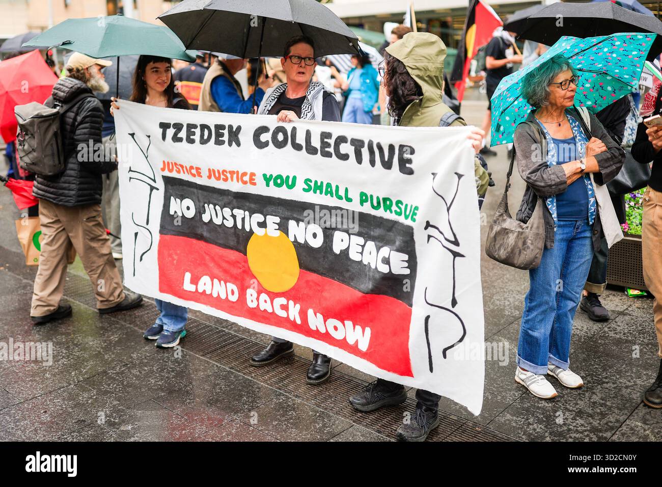 Protesters are seen with banners during the National Day of Action to ...
