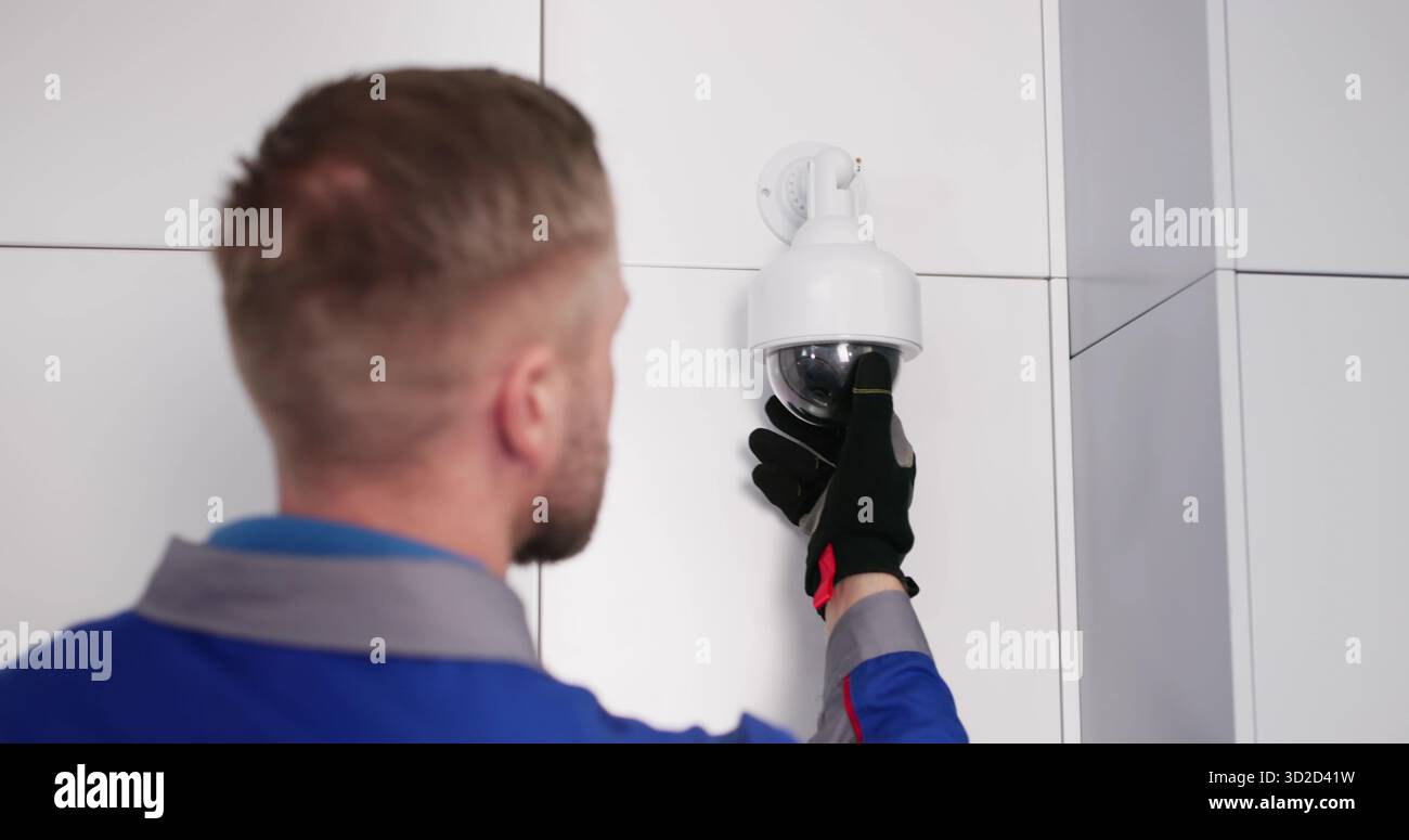 CCTV Expert Installs Security Camera System, Protecting Your Home Stock Photo