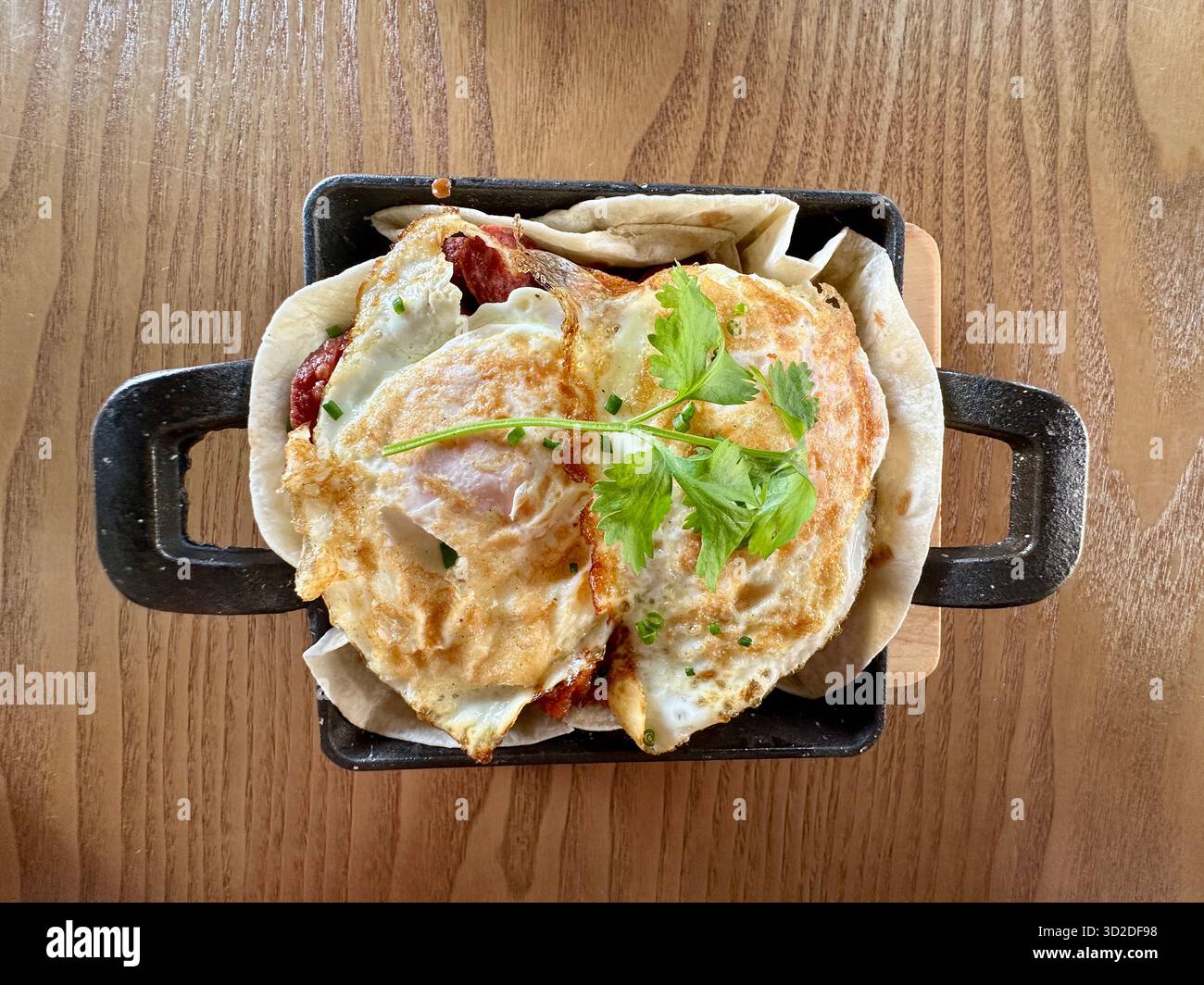 Spanish Eggs Breakfast on griddle pan - Smartphone Captured Stock Image