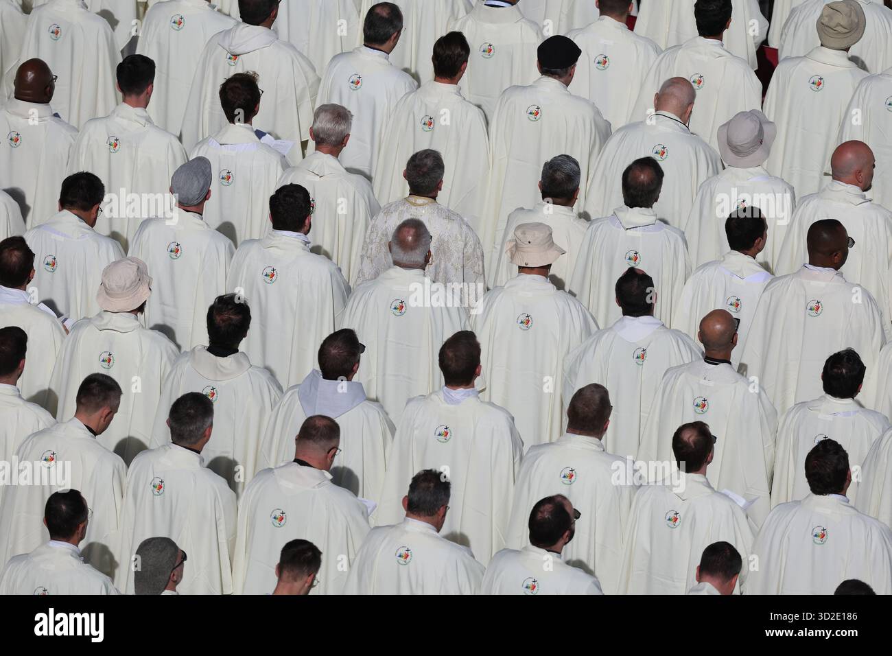 Rome - Italy, November 1, 2025: Priests in white robes line the square ...