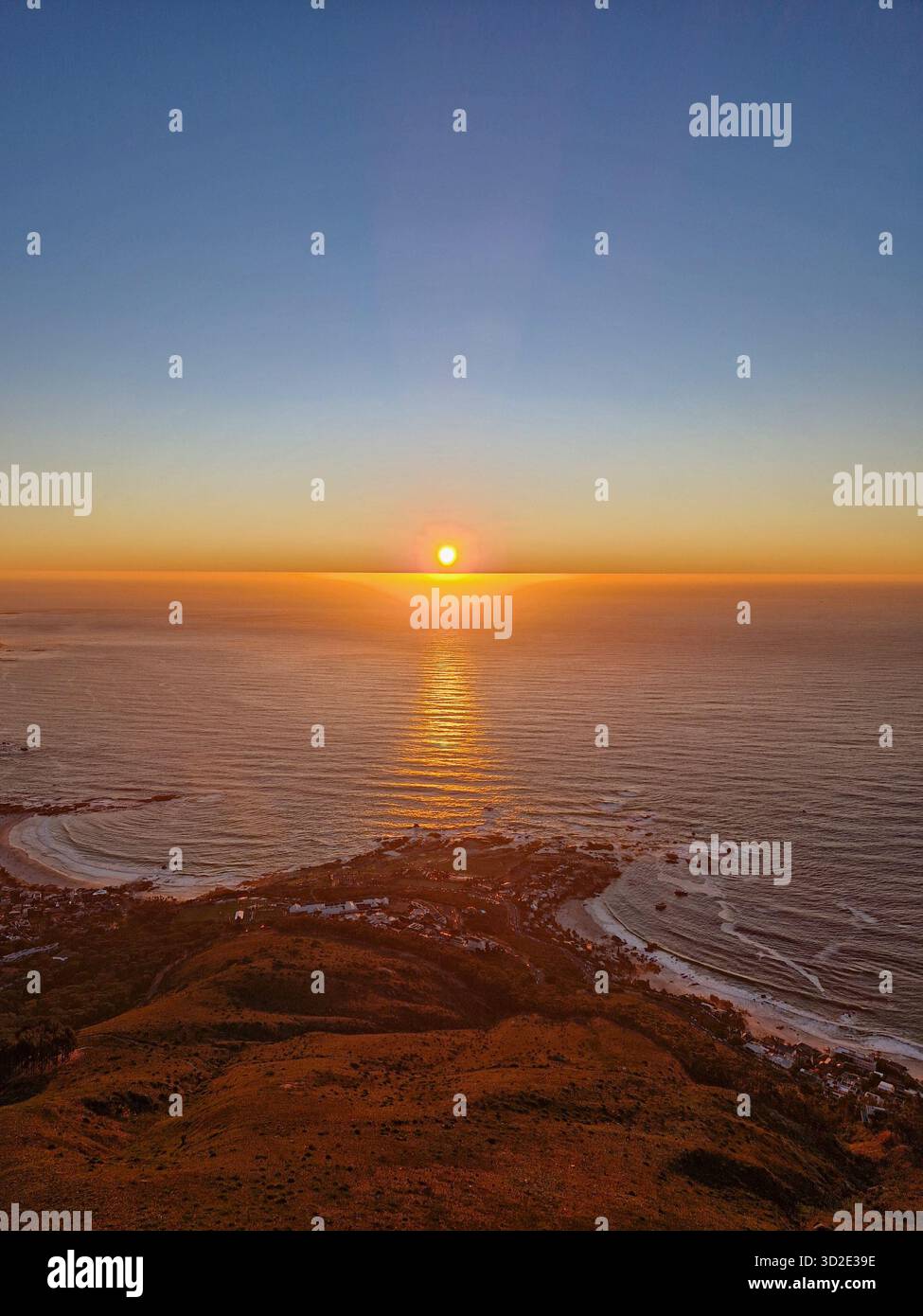 Golden sunset over the Atlantic Ocean from Lion's Head, Cape Town, South Africa - Smartphone Captured Stock Image