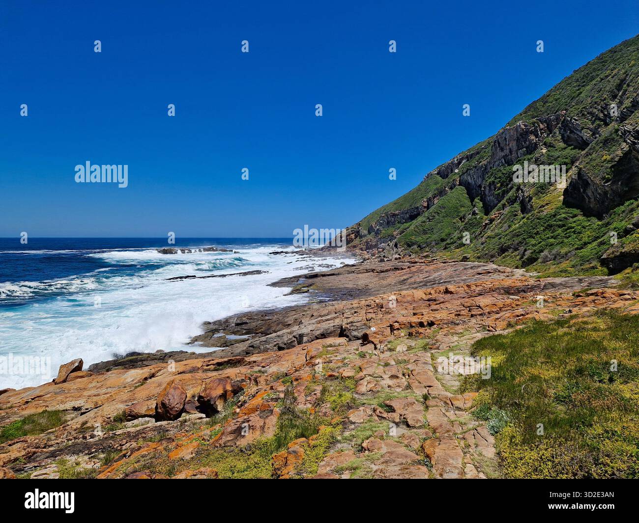 Rugged hiking trail on the coast of Robberg Nature Reserve, Garden Route, South Africa. - Smartphone Captured Stock Image
