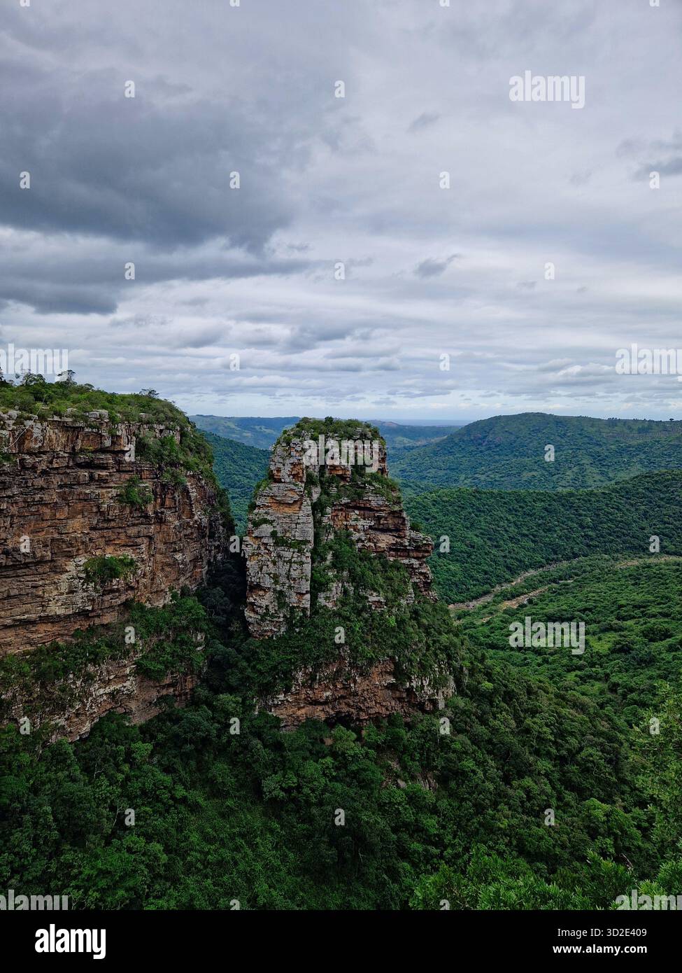 Lush green valley and rock pinnacle in Oribi Gorge, South Africa. - Smartphone Captured Stock Image