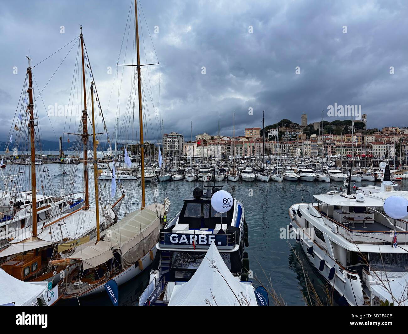 Luxury yachts in the Vieux Port of Cannes, France, during MIPIM real estate event - Smartphone Captured Stock Image