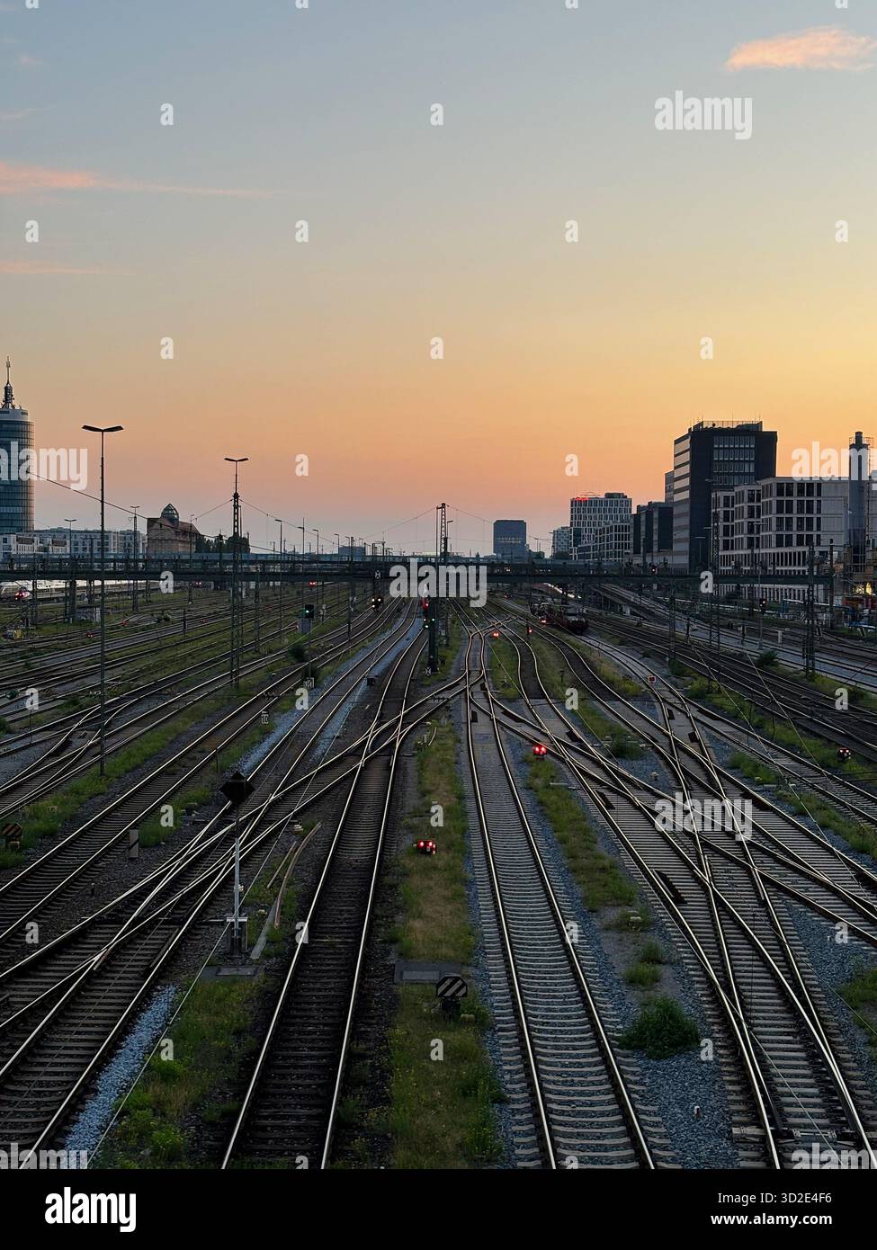 Munich's central railway tracks and switching points at sunset, Germany. - Smartphone Captured Stock Image
