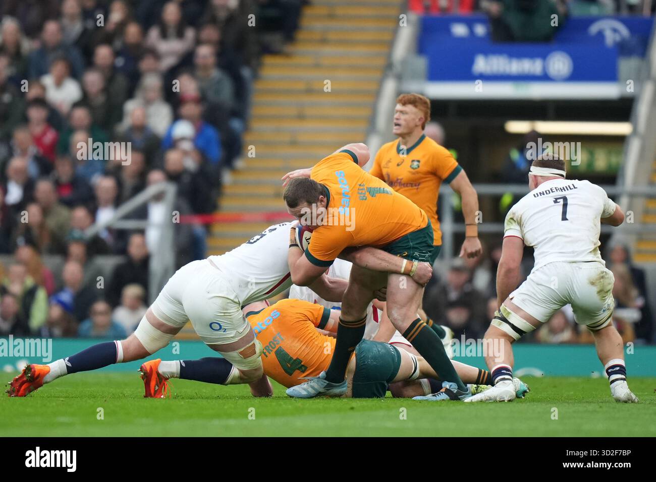 Australia's Angus Bell is tackled by England's Ollie Chessum during the ...